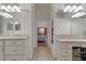 Spacious bathroom with double vanity and view of bedroom at 19387 Hidden Oaks Dr, Brooksville, FL 34604