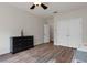 Bright bedroom with wood floors and double doors to closet at 19387 Hidden Oaks Dr, Brooksville, FL 34604