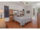 Primary bedroom with wood floors and built-in storage at 19387 Hidden Oaks Dr, Brooksville, FL 34604