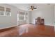 Bedroom featuring hardwood floors and bay window at 19387 Hidden Oaks Dr, Brooksville, FL 34604