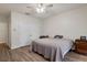 Bedroom with wood floors and double doors to closet at 19387 Hidden Oaks Dr, Brooksville, FL 34604