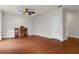Bright bedroom with hardwood floors and ceiling fan at 19387 Hidden Oaks Dr, Brooksville, FL 34604