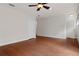 Spacious bedroom with hardwood floors and ceiling fan at 19387 Hidden Oaks Dr, Brooksville, FL 34604