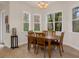 Breakfast nook with wood table and chairs near windows at 19387 Hidden Oaks Dr, Brooksville, FL 34604