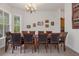 Formal dining room features a large table and hardwood floors at 19387 Hidden Oaks Dr, Brooksville, FL 34604