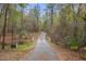 Long driveway leading to house through wooded area at 19387 Hidden Oaks Dr, Brooksville, FL 34604