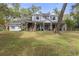 Two-story home with wrap-around porch and large yard at 19387 Hidden Oaks Dr, Brooksville, FL 34604
