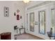 Bright entryway with double doors, featuring stained glass accents at 19387 Hidden Oaks Dr, Brooksville, FL 34604