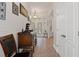 Bright hallway with hardwood floors and antique furniture at 19387 Hidden Oaks Dr, Brooksville, FL 34604