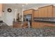 Modern kitchen with granite counters and stainless steel appliances at 19387 Hidden Oaks Dr, Brooksville, FL 34604
