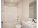 Clean bathroom with tub, sink, and toilet at 2049 Stillview Pass, Zephyrhills, FL 33541