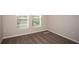 Bright bedroom with neutral walls and brown carpeting at 2049 Stillview Pass, Zephyrhills, FL 33541