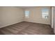 Bright bedroom with neutral walls and carpet at 2049 Stillview Pass, Zephyrhills, FL 33541