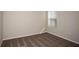 Simple bedroom with neutral walls, carpet, and a window with blinds at 2049 Stillview Pass, Zephyrhills, FL 33541