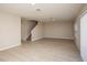 Spacious living room with light wood-look flooring and sliding glass door at 2049 Stillview Pass, Zephyrhills, FL 33541