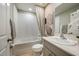 Clean bathroom with a bathtub, shower, and updated vanity at 2103 Stillview Pass, Zephyrhills, FL 33541