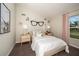Charming bedroom with whimsical decor and a built-in bookshelf at 2103 Stillview Pass, Zephyrhills, FL 33541
