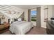 Cozy bedroom with fishing-themed decor and ample natural light at 2103 Stillview Pass, Zephyrhills, FL 33541