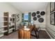 Functional home office with built-in shelving and a large desk at 2103 Stillview Pass, Zephyrhills, FL 33541
