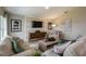 Living room with neutral decor, hardwood floors, and a built-in media wall at 2103 Stillview Pass, Zephyrhills, FL 33541