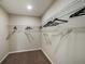 Spacious walk-in closet with wire shelving and plenty of hanging space at 2103 Stillview Pass, Zephyrhills, FL 33541
