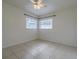 Simple bedroom with tile floors and ceiling fan at 220 74Th N Ave, St Petersburg, FL 33702