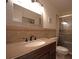 Bathroom with granite vanity, updated fixtures, and a glass-enclosed shower at 2221 Swedish Dr # 11, Clearwater, FL 33763