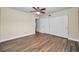 Bedroom with wood-look floors and closet space at 2221 Swedish Dr # 11, Clearwater, FL 33763