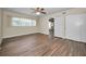 Bedroom with wood-look floors and closet space at 2221 Swedish Dr # 11, Clearwater, FL 33763