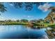 Scenic pond with a charming gazebo, set against a backdrop of lush greenery and blue skies at 2221 Swedish Dr # 11, Clearwater, FL 33763
