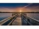 Tranquil sunset view from the end of the wooden dock over the lake at 2221 Swedish Dr # 11, Clearwater, FL 33763
