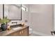 Modern bathroom with dark wood vanity and floating sink at 3010 W Trilby Ave, Tampa, FL 33611