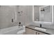 Clean bathroom, bathtub, modern vanity, and updated fixtures at 3010 W Trilby Ave, Tampa, FL 33611