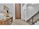 Bright and airy entryway with a large wooden door and modern console table at 3010 W Trilby Ave, Tampa, FL 33611