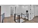 Modern hallway with wood floors and sleek railing at 3010 W Trilby Ave, Tampa, FL 33611