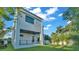 Modern home exterior showcasing a backyard and lush landscaping at 3010 W Trilby Ave, Tampa, FL 33611