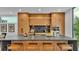 Modern kitchen with light wood cabinetry and expansive island at 3010 W Trilby Ave, Tampa, FL 33611