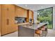 Modern kitchen with light wood cabinetry and expansive island at 3010 W Trilby Ave, Tampa, FL 33611
