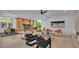 Open living space with a modern sofa, chairs, and a large window at 3010 W Trilby Ave, Tampa, FL 33611