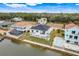 Aerial view of waterfront home with private pool and canal access at 3431 Palometa Dr, Hernando Beach, FL 34607