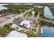 Aerial view showing a waterfront bar and restaurant with outdoor seating at 3431 Palometa Dr, Hernando Beach, FL 34607