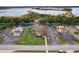 Aerial view of waterfront property with parking and surrounding landscape at 3431 Palometa Dr, Hernando Beach, FL 34607