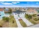 Two-story house with canal, paver driveway, and neighborhood view at 3431 Palometa Dr, Hernando Beach, FL 34607