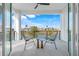 Private balcony overlooking a tranquil waterway with seating for two at 3431 Palometa Dr, Hernando Beach, FL 34607