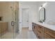 Elegant bathroom with double vanity, a walk-in shower, and modern fixtures at 3431 Palometa Dr, Hernando Beach, FL 34607