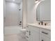 Modern bathroom with white vanity and walk-in shower at 3431 Palometa Dr, Hernando Beach, FL 34607