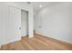 Spacious bedroom with light wood floors and closet at 3431 Palometa Dr, Hernando Beach, FL 34607