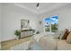 Bedroom with a queen bed, light decor, and access to a private balcony at 3431 Palometa Dr, Hernando Beach, FL 34607