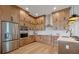 Stainless steel appliances and ample cabinetry in this updated kitchen at 3431 Palometa Dr, Hernando Beach, FL 34607