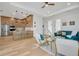 Modern kitchen with light wood cabinets, stainless steel appliances, and an island with seating at 3431 Palometa Dr, Hernando Beach, FL 34607